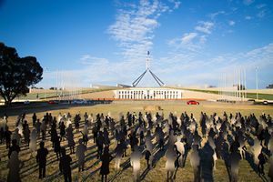 231 children's silhouettes on Parliament lawn